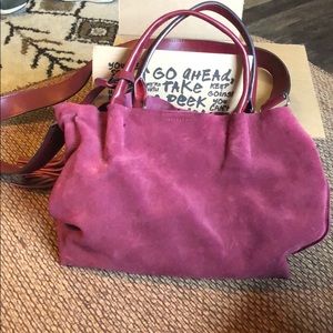 Maroon faux suede tassel bag